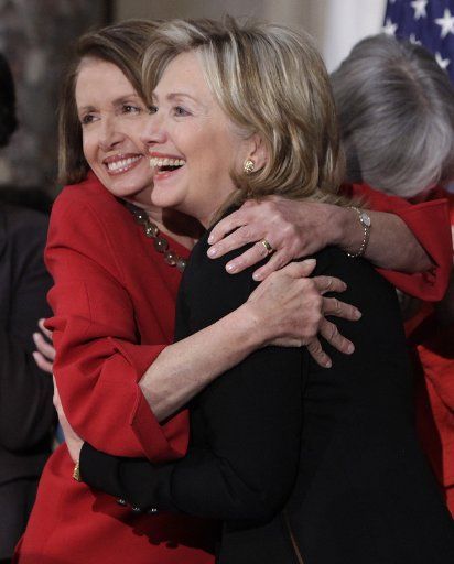 House Speaker Nancy Pelosi (L) (D-CA) embraces U.S. Secretary of State Hillary Clinton during a Women\