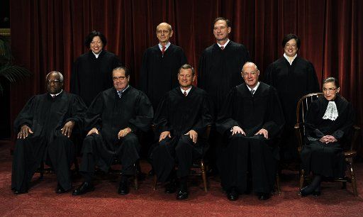 The Supreme Court Justices of the United States sit for a formal group photo in the East Conference Room of the Supreme Court in Washington on October 8 2010. The Justices are (front row from left) Clarence Thomas Antonin Scalia John G. Roberts (...