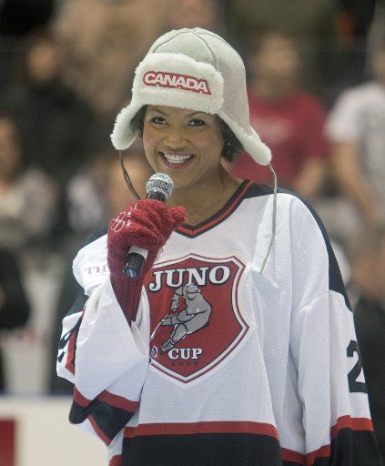Soprano Measha Brueggergosman sings the national anthem before the start of the Juno Cup pitting The Rockers against the NHL Greats at the Ricoh Center during the 2011 Juno Awards in Toronto Ontario March 25 2011. UPI Photo \/Heinz