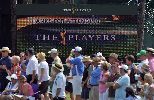 A sign board flashes a message to fans along the 2nd green as they wait for a group of golfers to approach during the second round of The Players Championship Friday May 13 2011 on the Stadium Course at TPC Sawgrass in Ponte Vedra Beach Florida. ...
