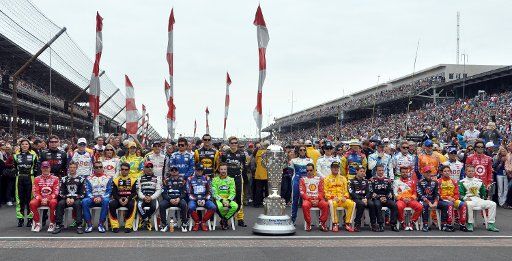 Drivers pose for a group portrait with the Bourg-Warner trophy before the 97th running of the Indianapolis 500 at Indianapolis Motor Speedway in Indianapolis, on May 26, 2013. UPI \/Mark