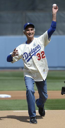 Former Dodger Sandy Koufax throws out the first pitch before the Los Angeles Dodgers play the San Francisco Giants on opening day at Dodger Stadium in Los Angeles on April 1, 2013. UPI Photo\/ Phil