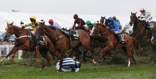 Jockeys jump the famous Chair in the 2014 Crabbies Grand National race on his horse at odds of at Aintree,Liverpool Saturday April 05 2014. (UPI Photo\/Hugo Philpott)