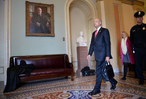 Homeland Security Secretary Jeh Johnson walks through the halls of the Capitol Building on January 20, 2015. Photo by Kevin Dietsch\/
