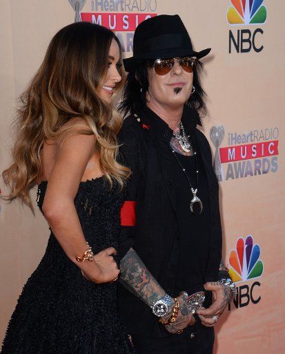 Musician Niki Sixx, right, and Courtney Bingham attend the iHeartRadio Music Awards at the Shrine Auditorium in Los Angeles on March 29, 2015. Photo by Jim Ruymen\/UPI..