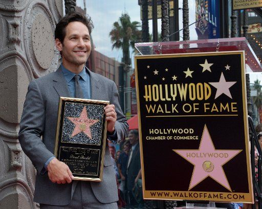 Actor Paul Rudd holds a replica plaque during an unveiling ceremony honoring him with the 2,554th star on the Hollywood Walk of Fame in Los Angeles on July 1, 2015. Photo by Jim Ruymen\/