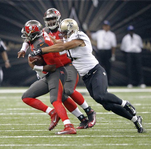 Tampa Bay Buccaneers quarterback Jameis Winston (3) is sacked by New Orleans Saints outside linebacker Kasim Edebali (91) during the second quarter at the Mercedes-Benz Superdome in New Orleans September 20, 2015. Photo by AJ Sisco\/