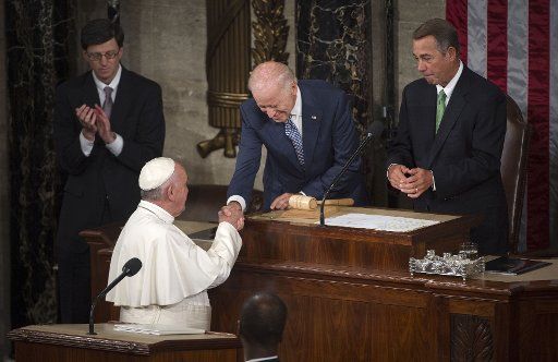 Pope Francis shakes hands with Vice President Joe Biden before addressing a Joint Meeting of Congress at the U.S. Capitol Building in Washington, D.C. on September 24, 2015. Photo by Kevin Dietsch\/
