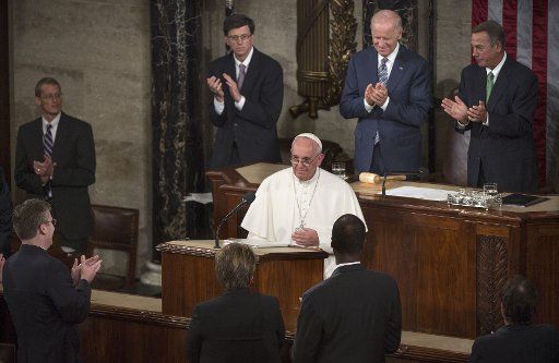 Pope Francis receives applause after addressing a Joint Meeting of Congress at the U.S. Capitol Building in Washington, D.C. on September 24, 2015. Photo by Kevin Dietsch\/