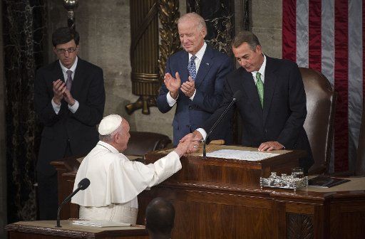 Pope Francis shakes hands Speaker of the House John Boehner before addressing a Joint Meeting of Congress at the U.S. Capitol Building in Washington, D.C. on September 24, 2015. Photo by Kevin Dietsch\/