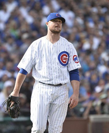 Chicago Cubs starting pitcher Jon Lester reacts after giving up and RBI single to Pittsburgh Pirates\