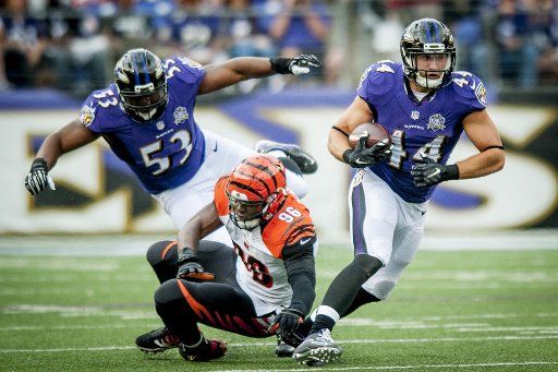Baltimore Raven fullback Kyle Juszczyk breaks a tackle during the third quarter against the Cincinatti Bengals at M&M Bank Stadium on September 27, 2015 in Baltimore, Maryland. The Bengals won the game 28-24. Photo by Pete Marovich\/UPIPhoto by Pete ...