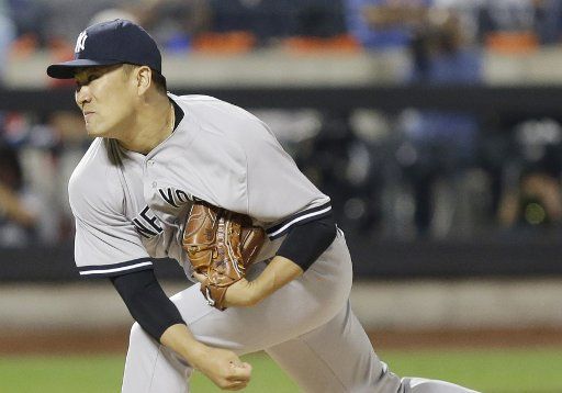 New York Yankees starting pitcher Masahiro Tanaka throws a pitch in the first inning against the New York Mets at Citi Field in New York City on September 18, 2015. Photo by John Angelillo\/