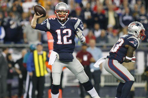 New England Patriots quarterback Tom Brady (12) drops back for a pass in the first quarter against the Miami Dolphins at Gillette Stadium in Foxborough, Massachusetts on October 29, 2015. Photo by Matthew Healey\/