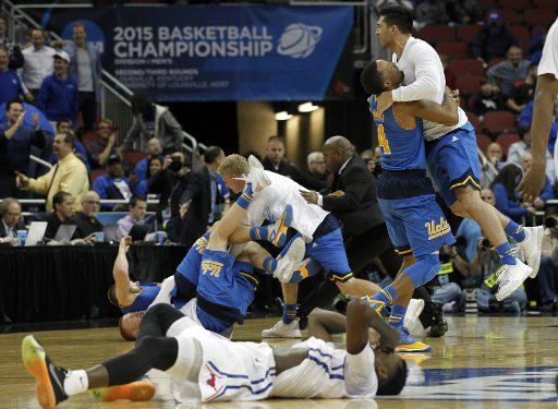 The UCLA Bruins basketball team celebrate after defeating the SMU Mustangs in their second round game of the 2015 NCAA Division I Men\