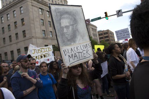 Demonstrators march to protest the death of Freddie Gray in Baltimore, Maryland on April 29, 2015. Freddie Gray died after suffering a spinal injury while being arrested by Baltimore City Police earlier this month. Photo by Kevin Dietsch\/