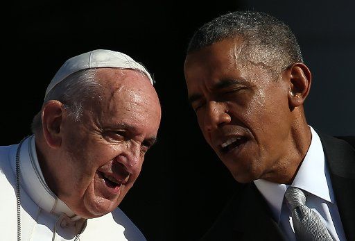 U.S. President Barack Obama (R) confers with Pope Francis (L) during an arrival ceremony at the White House on September 23, 2015 in Washington, DC. The Pope begins his first trip to the United States at the White House followed by a visit to St. ...