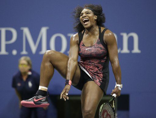 Serena Williams reacts after a point in her match against Venus Williams in the quarter finals in Arthur Ashe Stadium on day 9 at the US Open Tennis Championships at the USTA Billie Jean King National Tennis Center in New York City on September 8, ...
