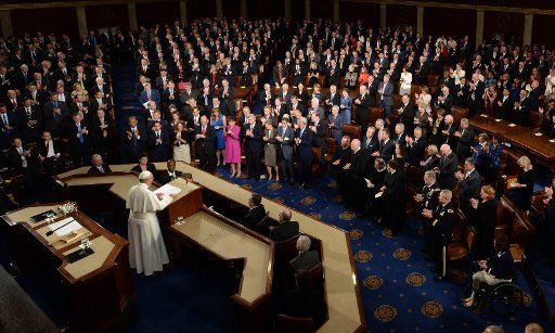 Pope Francis receives a standing ovation as he addresses a joint meeting of Congress at the U.S. Capitol in Washington, DC on September 24, 2015. Francis is the first Pope to address Congress. The Pope is on his first trip to the United States, ...