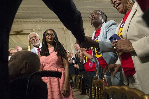 President Barack Obama greets audience members during the 2015 White House Conference on Aging at the White House in Washington, D.C. on July 13, 2015. This conference marks the 50th anniversary of Medicare, Medicaid, and the Older Americans Act, as ...
