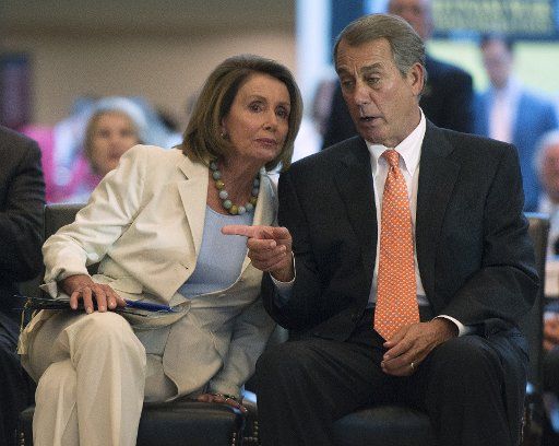 House Minority Leader Nancy Pelosi, D-Calif., and Speaker of the House John Boehner, R-Ohio, talk during the Congressional Commemoration Ceremony in honor of the 50th anniversary of the Vietnam War, on Capitol Hill in Washington, D.C. on July 8, ...
