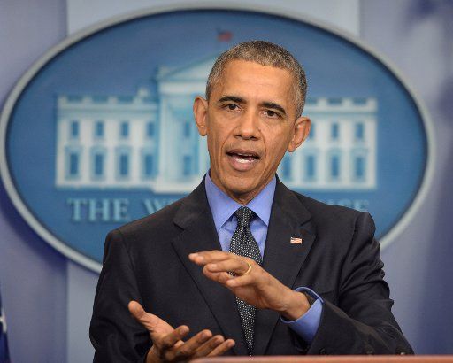 U.S. President Barack Obama makes a comment at a year-end press conference in the Brady Press Briefing Room at the White House in Washington, DC on December 18, 2015. The president discussed a variety of topics before heading later in the day to ...