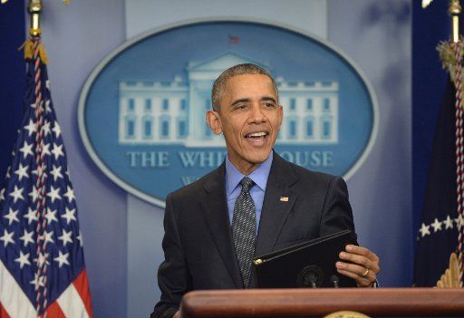 U.S. President Barack Obama smiles as he ends his year-end press conference in the Brady Press Briefing Room at the White House in Washington, DC on December 18, 2015. The president discussed a variety of topics before heading later in the day to ...