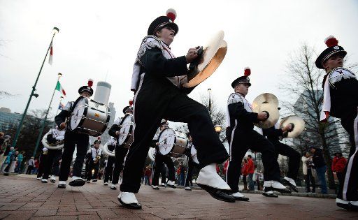 The Falconland Dancing Band performs during the annual Chick-fil-A Peach Bowl Parade where Florida State University faced the University of Houston December 31, 2015, in Atlanta. Photo by David Tulis\/
