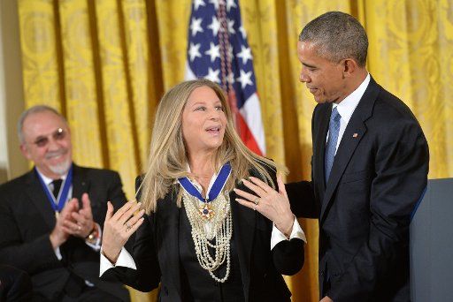President Barack Obama awards the Medal of Freedom to singer Barbra Streisand during a ceremony at the White House in Washington, D.C. November 24, 2015. Photo by Kevin Dietsch\/