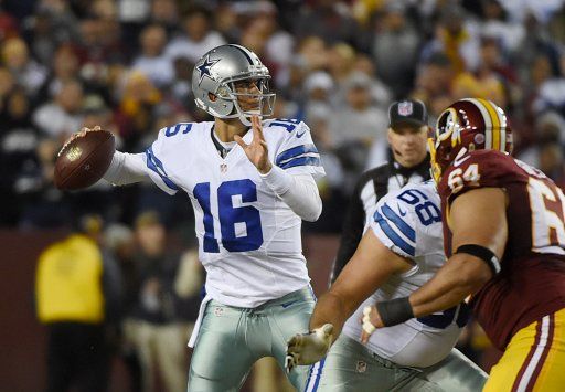 Dallas Cowboys quarterback MattÊ Cassel (16) throws against the Washington Redskins during first quarter at FedEx Field in Landover, Maryland on December 7, 2015. Photo by Molly Riley\/