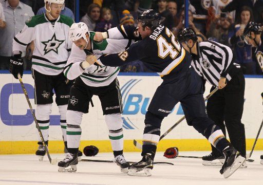 St. Louis Blues David Backes lands a punch to the face of Dallas Stars Jamie Benn in the first period at the Scottrade Center in St. Louis on December 12, 2105. St. Louis defeated Dallas 3-0. Photo by Bill Greenblatt\/
