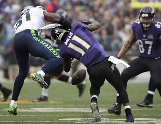 Seattle Seahawks strong safety Kam Chancellor (31) blocks a pass intended for Baltimore Ravens wide receiver Kamar Aiken (11) during the first half of their NFL game at M&T Bank Stadium in Baltimore, Maryland, December 13, 2015. Photo by David Tulis\/...
