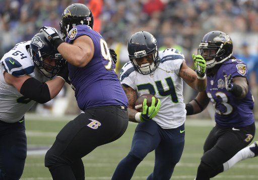 Seattle Seahawks running back Thomas Rawls (34) rushes for short yardage against the Baltimore Ravens during the first half of their NFL game at M&T Bank Stadium in Baltimore, Maryland, December 13, 2015. Photo by David Tulis\/