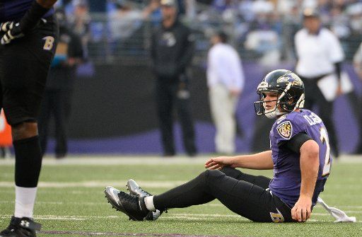 Baltimore Ravens quarterback Jimmy Clausen (2) sits on the turf after an incomplete fourth down pass against the Seattle Seahawks late in the second half of their NFL game at M&T Bank Stadium in Baltimore, Maryland, December 13, 2015. Seattle won 35-...