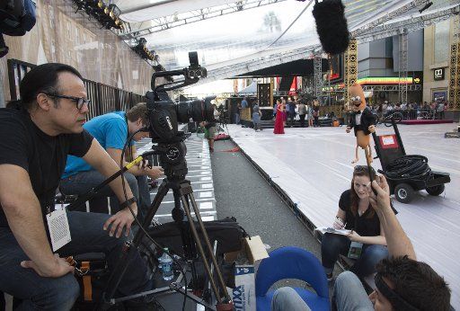 A video crew interviews a hotdog as preparations are underway for the 88th Academy Awards in the Hollywood section of Los Angeles on February 25, 2016. The Oscars will be presented Sunday, February 28. Photo by Phil McCarten\/