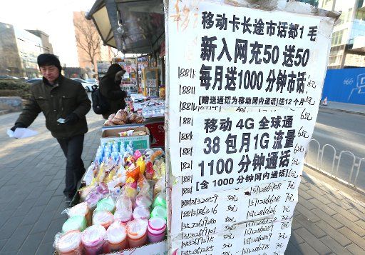 A street vendor sells phone packages and \