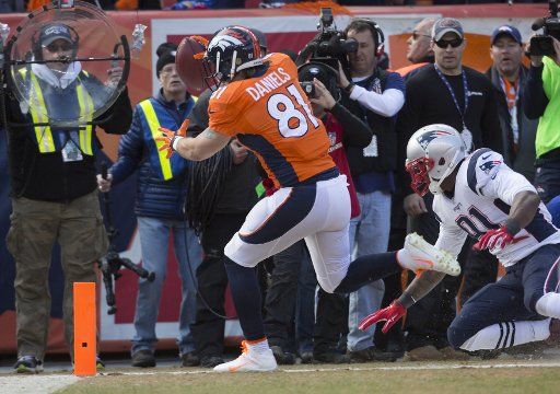 Denver Broncos tight end Owen Daniels (81) scores on a 12-yard touchdown pass against the New England Patriots in the second quarter during the AFC Championship game at Sport Authority Field at Mile High in Denver on January 24, 2016. Photo by ...