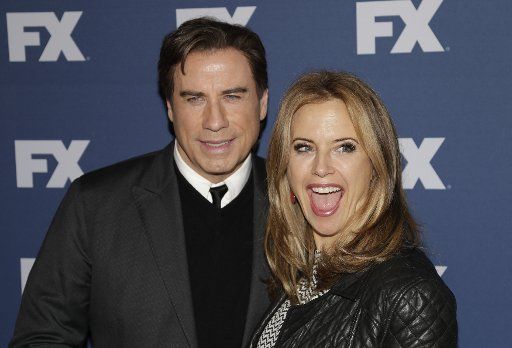 John Travolta and Kelly Preston arrive on the red carpet at the FX Networks upfront screening of \