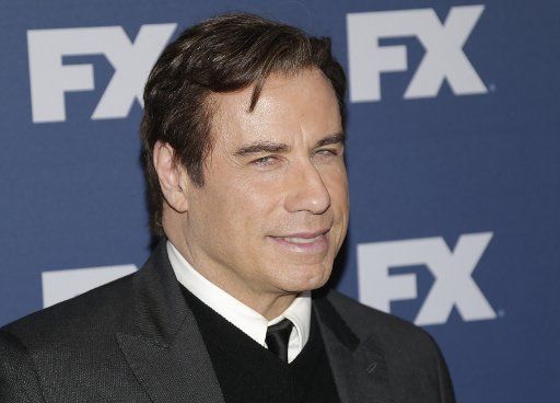 John Travolta arrives on the red carpet at the FX Networks upfront screening of \