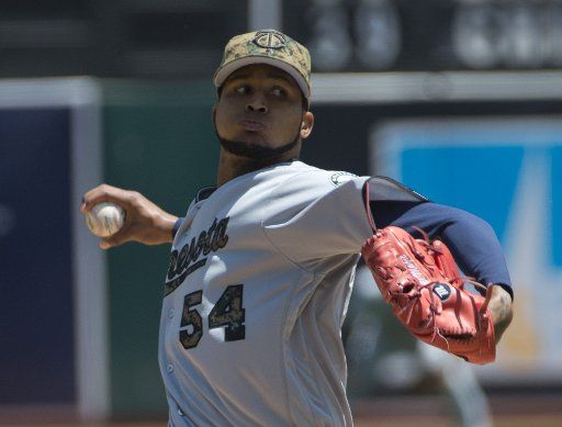 Minnesota Twins starting pitcher Ervin Santana throws to the Oakland A\