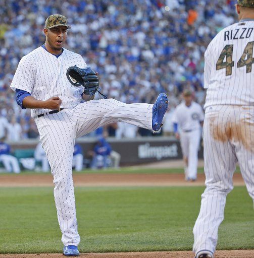 Chicago Cubs relief pitcher Hector Rondon (L) reacts after getting a final out against the Los Angeles Dodgers during the ninth inning at Wrigley Field in Chicago on May, 30, 2016. Photo by Kamil Krzaczynski\/