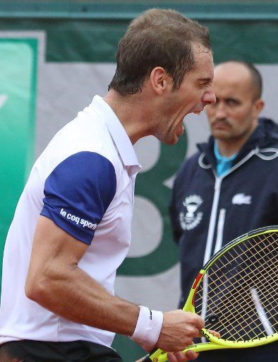 Richard Gasquet of France reacts after a shot during his French Open men\
