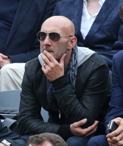 Retired French footballer Fabien Barthez watches the French Open men\