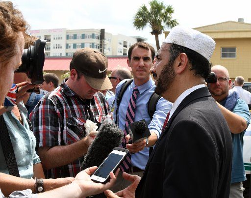 IMAM Muhammad Masri, President of the Islamic Society of Central Florida talks to the media in downtown Orlando after a lone gunman shot and killed fifty nightclub attendees and wounded more than another fifty victims at the Pulse gay nightclub in ...