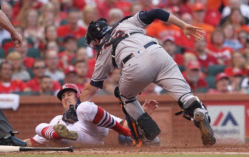 Houston Astros catcher Jason Castro tags out St. Louis Cardinals Stephen Piscotty at home plate as he tries to score in the fifth inning at Busch Stadium in St. Louis on June 15, 2016. Photo by Bill Greenblatt\/