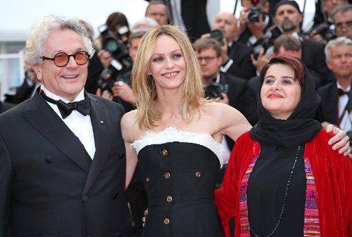 Jury President George Miller (L), Vanessa Paradis (C) and Katayoon Shahabi arrive on the red carpet before the closing ceremony of the 69th annual Cannes International Film Festival in Cannes, France on May 22, 2016. Photo by David Silpa\/