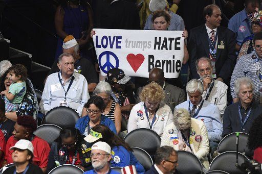 A Florida delegate holds up an anti-Donald Trump and pro-Bernie Sanders banner, at the 2016 Democratic National Convention, at Wells Fargo Center in Philadelphia, Pennsylvania on July 25, 2016. The delegates will confirm the nomination of Hillary ...