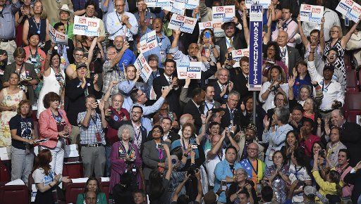 Massachusetts delegates cheer as they hold the nominating and roll call vote, at the 2016 Democratic National Convention at Wells Fargo Center in Philadelphia, Pennsylvania on July 26, 2016. The delegates will confirm the nomination of Hillary ...