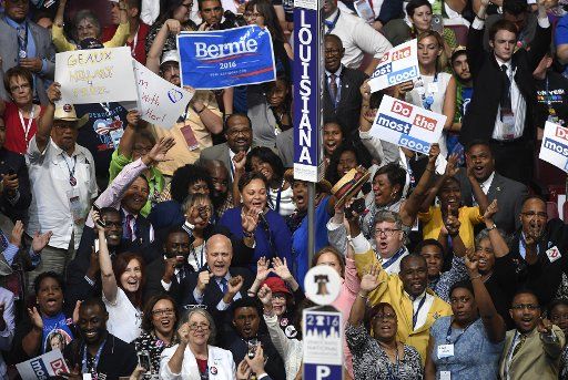 Louisiana delegates cheer as they hold the nominating and roll call vote, at the 2016 Democratic National Convention at Wells Fargo Center in Philadelphia, Pennsylvania on July 26, 2016. The delegates will confirm the nomination of Hillary Clinton ...