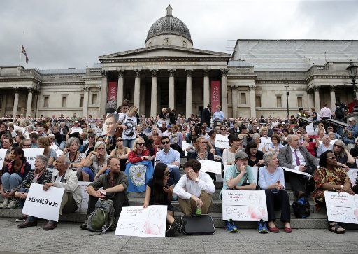 Members of the public hold pictures of murdered member of Parliament Jo Cox who was murdered in her constituency last Thursday at a Remembrance Celebration in Trafalgar Square, London June 22, 2016. Memorials for the MP are being held all over the ...